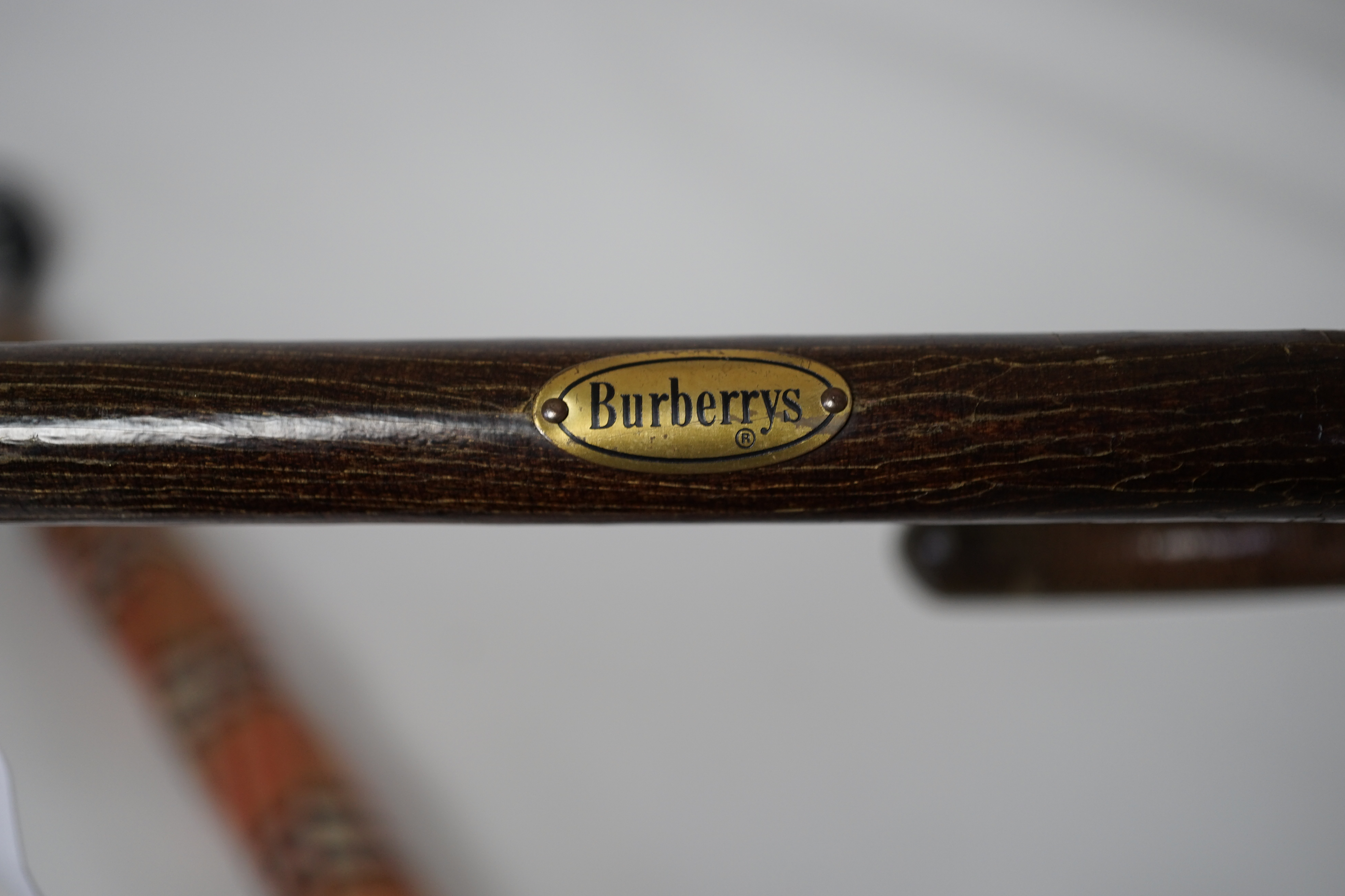 A vintage Burberry shooting stick umbrella and a lady's vintage cotton umbrella, shooting stick height 91cm, umbrella 83cm
